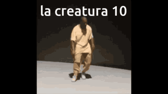 a man is dancing in front of a sign that says la creature 10 .