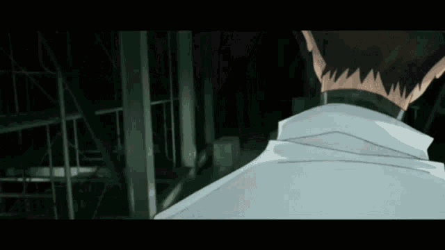 a man in a white shirt is looking over his shoulder