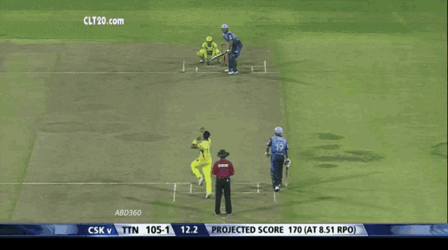 a tv screen shows a cricket match between csk v and tn
