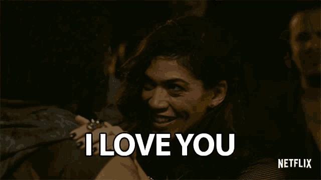 a woman is smiling and says i love you
