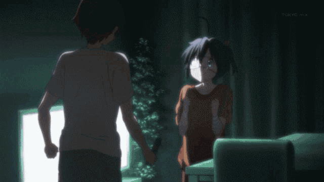 a girl with a bandage on her eye looks at the camera with tokyo mx in the background