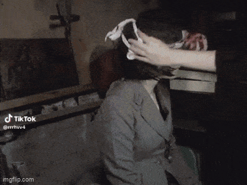 a woman 's head is being touched by another person with a tiktok watermark