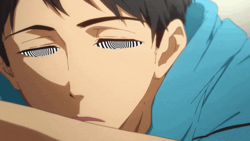 a close up of a man 's face with a hypnotic look on his eyes