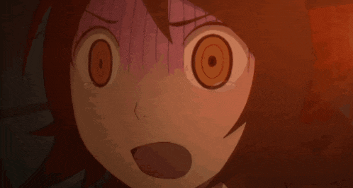 a close up of a person 's face with a surprised look on their face