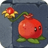 a cartoon pomegranate with leaves and a flower hanging from it .