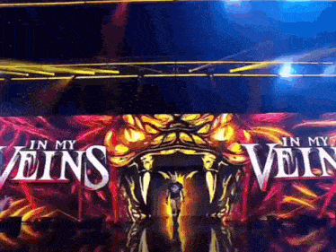 a man is walking into a stage with the words " in my veins " on it
