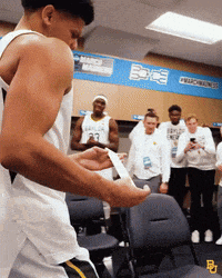 a basketball player with a bandage on his arm
