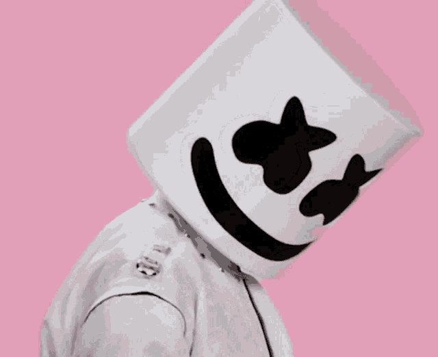 a man is wearing a marshmallow hat and covering his face with his hand .