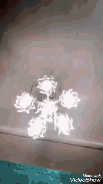 a video showing a snowflake is made with the videoshow app