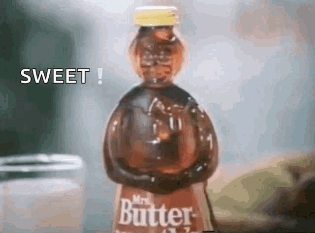 a bottle of mrs. butter is sitting on a table next to a jar