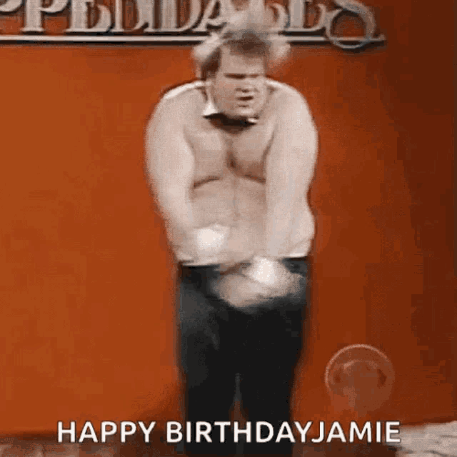 a man without a shirt is dancing in front of a red wall and says happy birthday jamie .