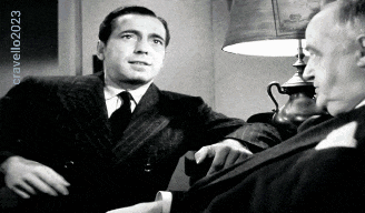 two men in suits and ties are sitting in front of a lamp and a sign that says cravello 2023