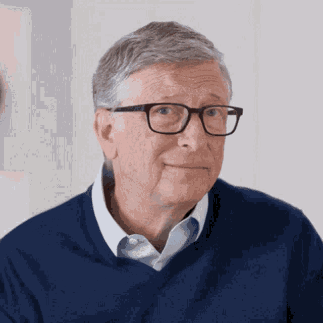 bill gates wearing glasses and a blue shirt