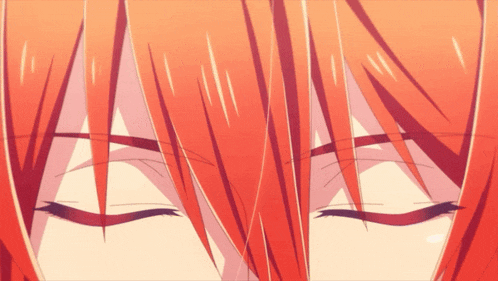 a close up of a person with red hair