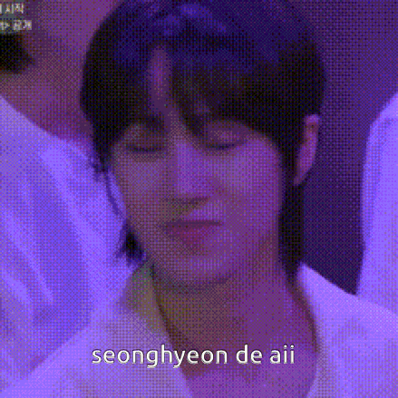 a close up of a person 's face with a purple background and the words seonghyeon de aii on it .