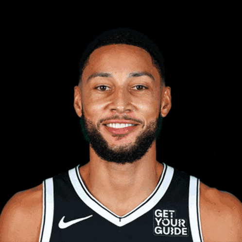 a basketball player wearing a jersey that says get your guide on it