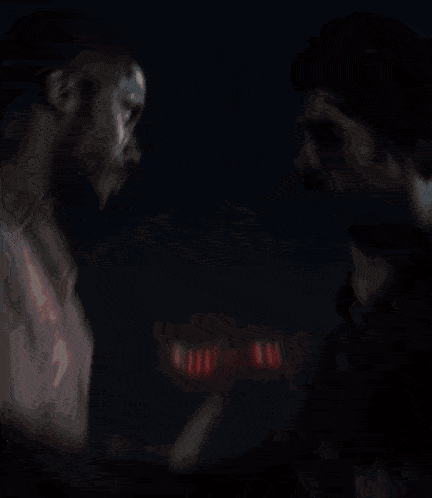 a painting of a man kissing another man with the word love written in red