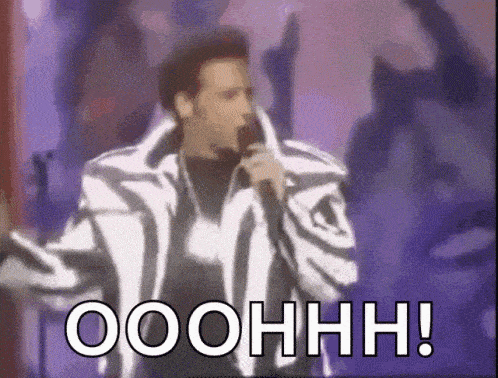 a man in a zebra print jacket is singing into a microphone with the words ooohhh written below him