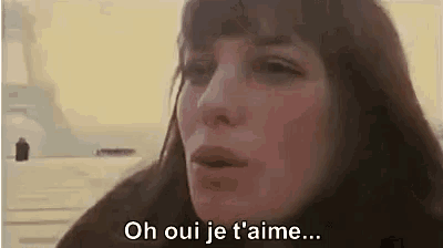 a close up of a woman 's face with the words `` oh oui je t'aime '' .