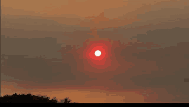 the sun is shining brightly in the sky at sunset