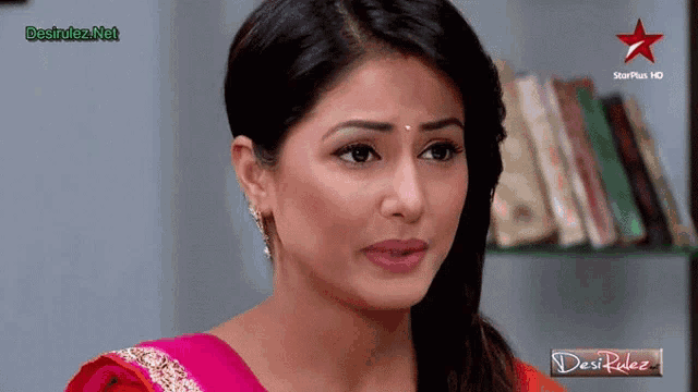 a woman 's face is displayed on a screen that says desi rulez