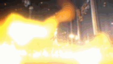 a blurred image of a flame coming out of a pipe