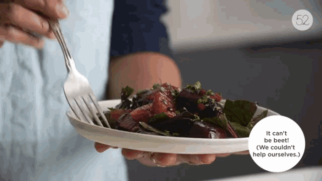 a person is holding a plate of food with a fork and the words it can 't be beet