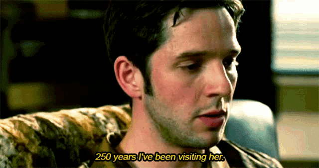 a man sitting on a couch with the words 250 years i 've been visiting her above him