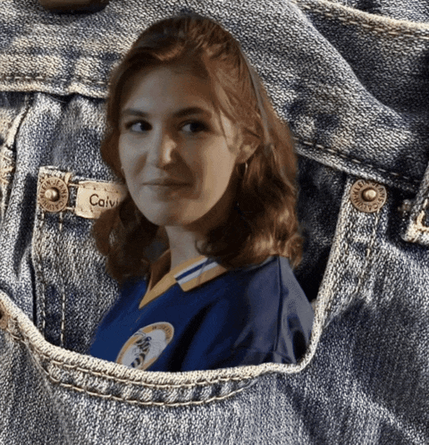 a woman in a blue shirt with calvi written on her name tag