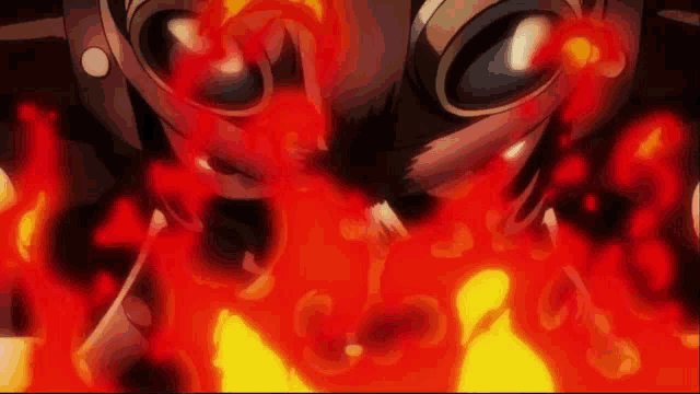 a close up of a cartoon character 's face with flames coming out of it .