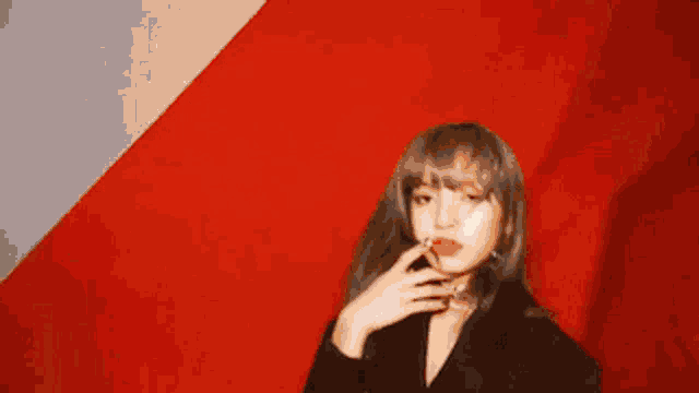 a blurry picture of a woman in a red curtain with the words lyza ante ever written on it