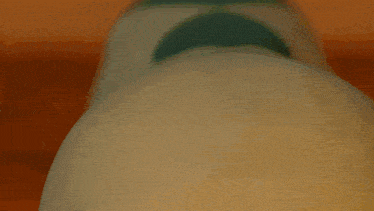 a close up of a toy with its eyes closed and its mouth open