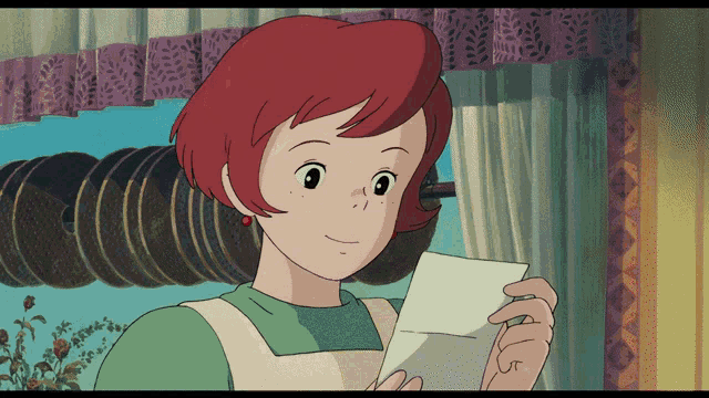 a woman with red hair is reading a letter