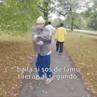 a man is dancing in a park with the words " baila si sos de lamu " written above him