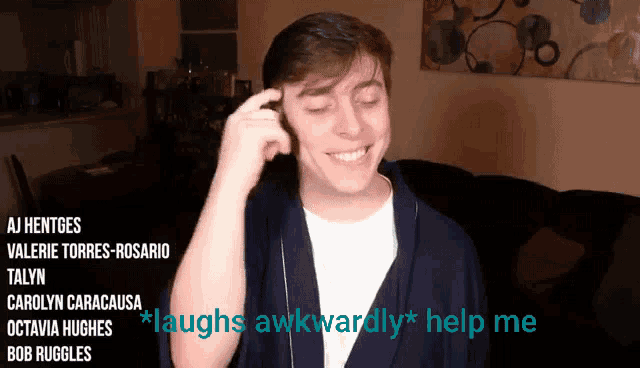 a man laughs awkwardly in front of a sign that says laughs awkwardly