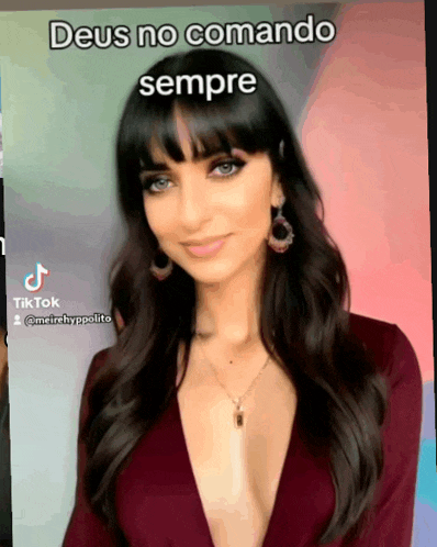 a woman in a plunging neckline is featured in a tiktok video with the caption deus no comando sempre
