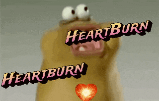 a cartoon character with big eyes and the words heartburn