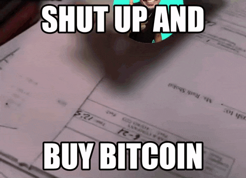 a sign that says " shut up and buy bitcoin " on it