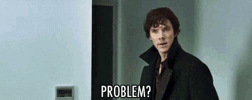 a man in a black coat is standing in front of a door and says `` problem '' .