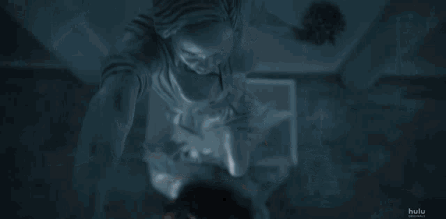 two women laying on a bed with hulu written on the bottom right