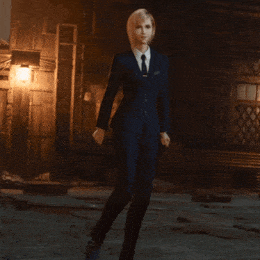 a blonde woman in a blue suit and tie