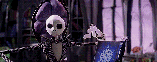 jack skellington from the nightmare before christmas is holding a book and a purple flower .