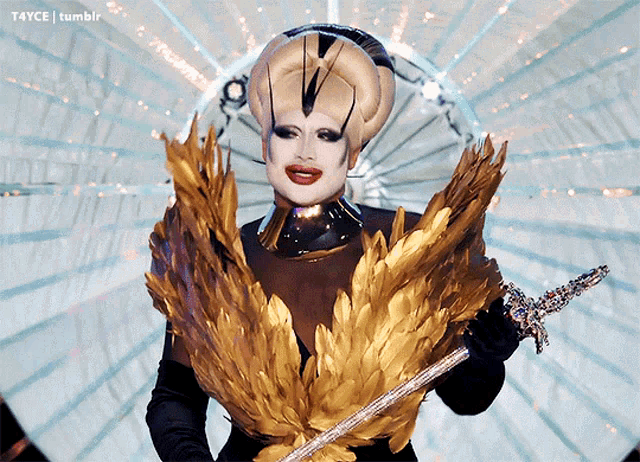 a drag queen is holding a sword in front of a t4yce tumblr logo