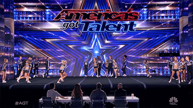 a group of cheerleaders are performing on a stage with the words america 's got talent
