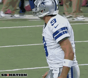 a football player wearing a helmet with a star on it and the number 8 on his jersey
