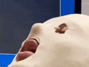a close up of a person 's face with a hole in it
