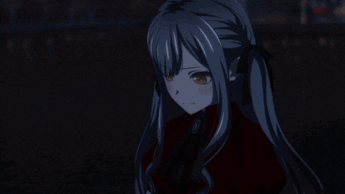 a girl with gray hair and a red dress is standing in a dark room