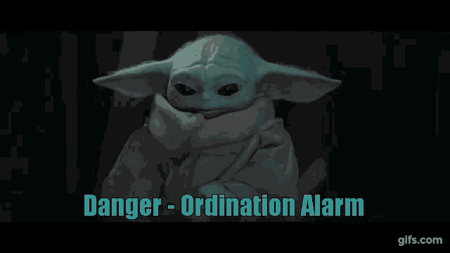 a baby yoda is sitting in a chair with the words danger - ordination alarm written above him .