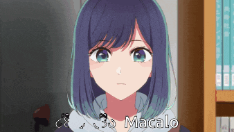 a girl with blue hair is standing in front of a bookshelf with the name macalo written on it