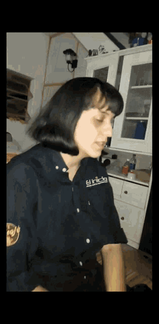 a woman wearing a shirt that says ' erica ' on the sleeve